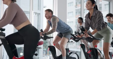 Fitness, indoor cycling and group workout with trainer for cardio, endurance challenge and laugh. Stationary bike, training and people in class for body health, exercise or sports with energy in gym - Powered by Adobe
