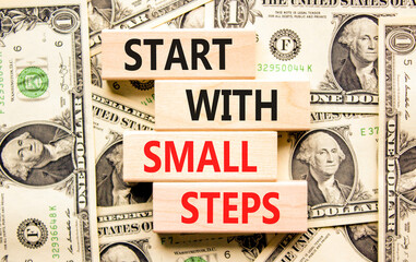 Start with small steps symbol. Concept words phrase Start with small steps on beautiful blocks....