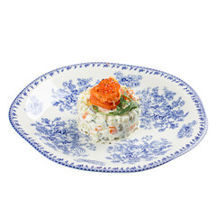 Portion of gourmet olivier salad with salmon