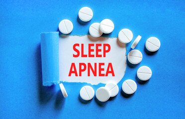 Sleep apnea symbol. Concept words Sleep apnea on beautiful white paper. White pills tablets....
