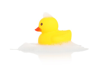 One cute rubber duck and foam on mirror surface against white background