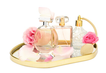 Many different perfume bottles and roses isolated on white