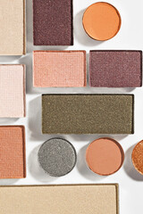 Beautiful eyeshadow refill pans on white background, flat lay
