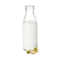 Nut milk in glass bottle and pistachios isolated on white