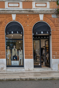Sisley clothing store facade in Old town of Porec, Croatia.