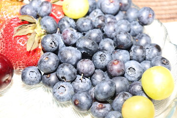 fresh berries and strawberry on a plate