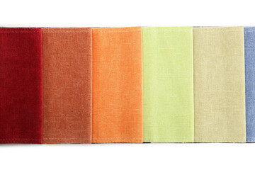 Samples of different fabrics isolated on white, top view