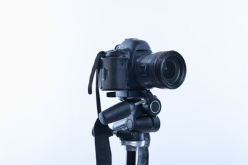 Modern professional video camera on white background