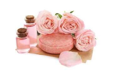 Aromatic soap bar, roses and cosmetic products isolated on white
