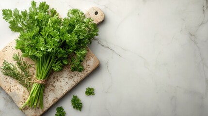 Fresh bunch of parsley and dill on a wooden cutting board.