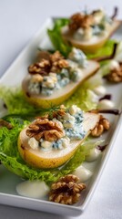 Elegant Pear and Blue Cheese Salad With Walnuts on a White Plate