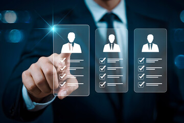 A businessman uses digital technology to review candidate profiles for recruitment selecting the best employee for a job opportunity improving business efficiency through technological advancement.