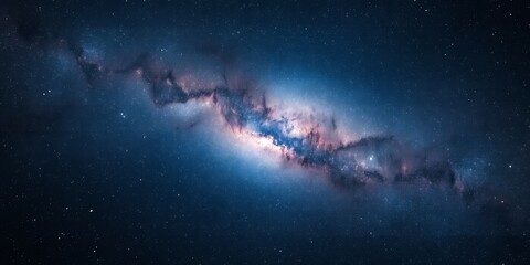 Fototapeta premium A view of the milky way galaxy with stars and cosmic dust in the night sky with blue hues visible