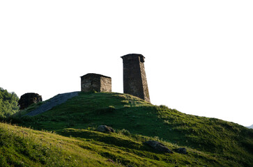 Ancient stone towers on a green hill against the sky historical architecture of the Caucasus transparent background