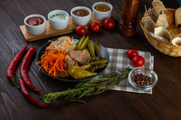 Spicy set, pickled vegetables on wooden background