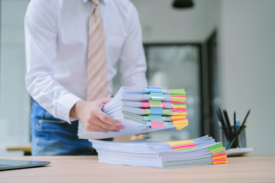 a businessman is sitting in his private office, an entrepreneur is working diligently, the chief accountant is reviewing documents and budget figures to present to the executives in a meeting
