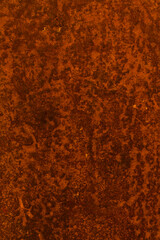 Rusty metal surface with a rough, mottled texture, natural corrosion pattern
