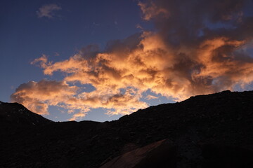 Glowing Clouds over a Mountain at Sunrise