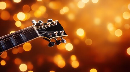 Fototapeta premium The close-up of a guitar neck featured against a stunning bokeh backdrop creates an artistic representation of music and creativity, capturing the passion of the musician.