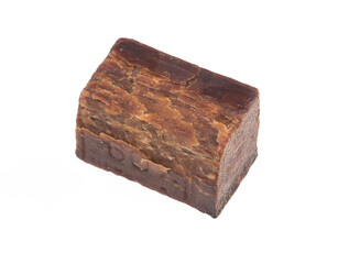 piece of old brown laundry soap isolated on white background