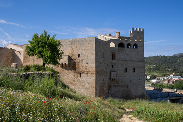 Medieval Valderrobres Castle in Teruel, Matarra&ntilde;a, Spain, stands majestically above the village, showcasing historic stone architecture and scenic mountain surroundings