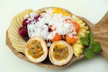 Different fresh fruits on white table, above view