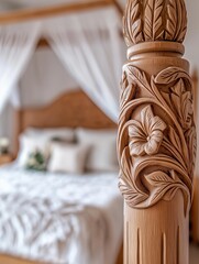 Intricately carved wooden bedpost featuring floral designs stands prominently in a beautifully decorated bedroom with soft linens and elegant drapery, showcasing craftsmanship and comfort