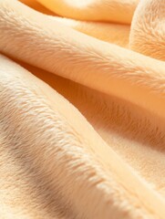 Soft, plush fabric in warm peach tones, showcasing gentle folds and textures, ideal for cozy home decor, upholstery, or fashion design projects with inviting ambiance