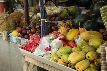 Different fresh ripe fruits at market, closeup