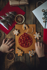 Concept of christmas leisure, family time, original do it yourself present. Little boy holding...