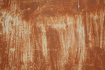 Background: Rusty metal sheet with white paint residue.
