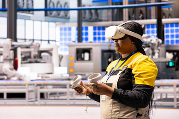 African american engineer interacting with virtual reality technology during industrial training. Factory manager with VR headset handling product simulation in Industry 4.0 warehouse.