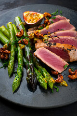 Tuna tataki steak with caramelized green asparagus, roasted cashew and  maracuja passion fruit...