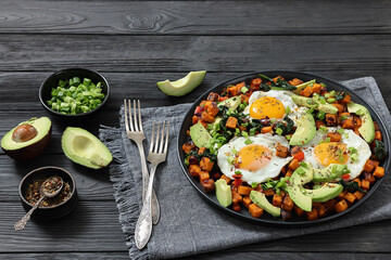 fried sweet potato cubes, eggs, and fresh avocado