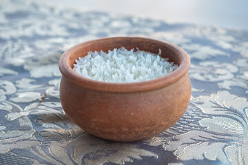 Steamed rice in a clay pot on the dining table