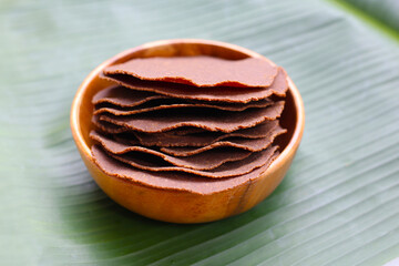 Fermented soybean discs, known as “Thua Nao,” a traditional Thai seasoning used to enhance flavor in Northern cuisine.