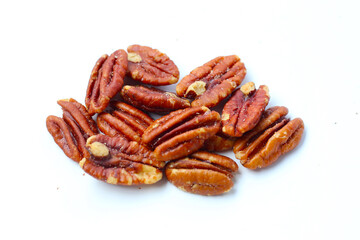 Delicious salted pecan nuts scattered.