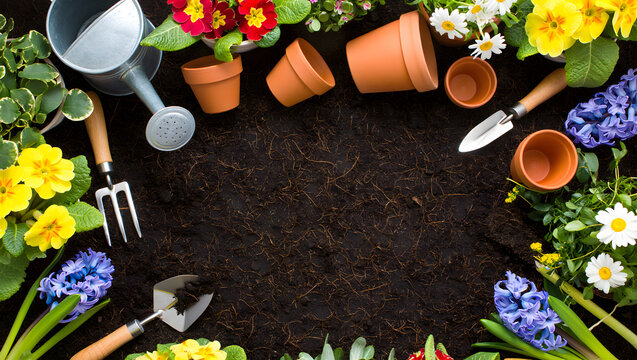 Spring gardening supplies and flowers rich soil background - Powered by Adobe