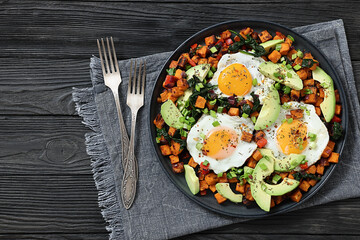 fried sweet potato cubes, eggs, and fresh avocado
