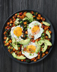 fried sweet potato cubes, eggs, and fresh avocado