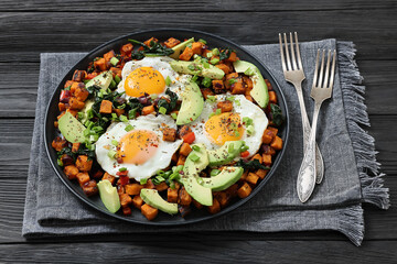 fried sweet potato cubes, eggs, and fresh avocado