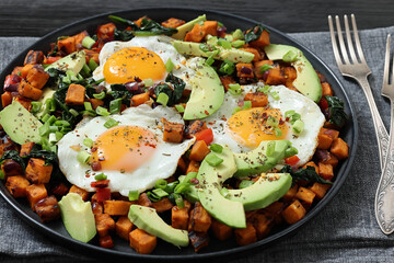 fried sweet potato cubes, eggs, and fresh avocado