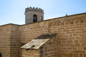 Historic Santa María la Mayor Church framed by medieval castle walls in Valderrobres, Teruel, with...