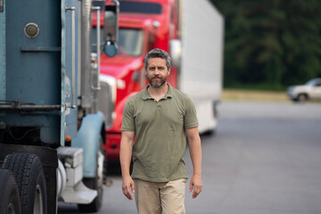 Man driver near lorry truck. Truck driver. Trucking owner. Transportation vehicles. Hispanic man in front of truck. Semi trucks vehicle. Man owner truck driver. Transportation industry. LTL drivers