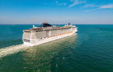 Travel at sea. Aerial drone view luxury liner. Ship leaving Miami port. Travel destination. Cruise...