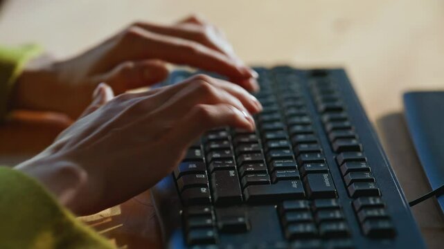 Hands inputting information keyboard finalizing message buyer indoors closeup