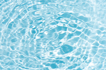 Blue water with ripples on the surface. Defocus blurred transparent blue colored clear calm water...
