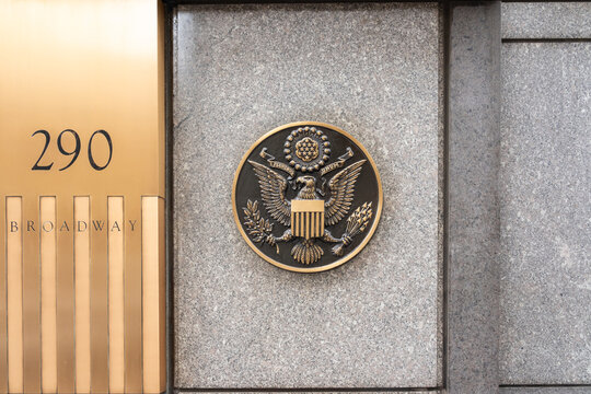 New York, NY, USA - August 22, 2022:  &ldquo;E pluribus unum&rdquo; metal seal on the government building at 290 Broadway in New York, NY, USA. The phrase "E pluribus unum" is the motto of the United States. 