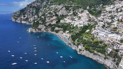 Naklejka premium Amalfi Coast At Positano In Salerno Italy. Coastal City. Waterfront Landscape. Amalfi Coast At Positano In Salerno Italy. Beach Scenery. Medieval Buildings. Amalfi Coast Skyline.