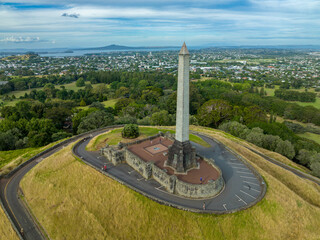 The Sir John Logan Campbell Monument stands tall over the green parkland of One Tree Hill Domain,...